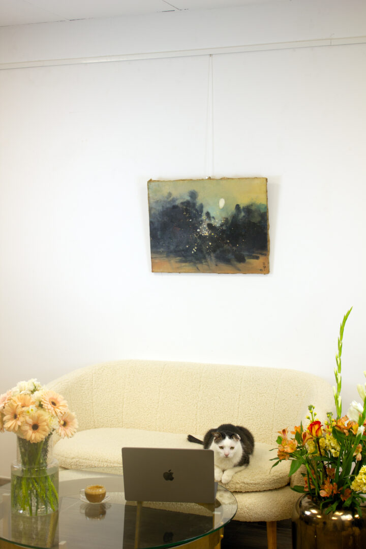 An interior setting featuring Celestial Abstraction, 1963 by Cheong Soo Pieng, elegantly displayed above a modern sofa, enhancing the ambiance of the space.