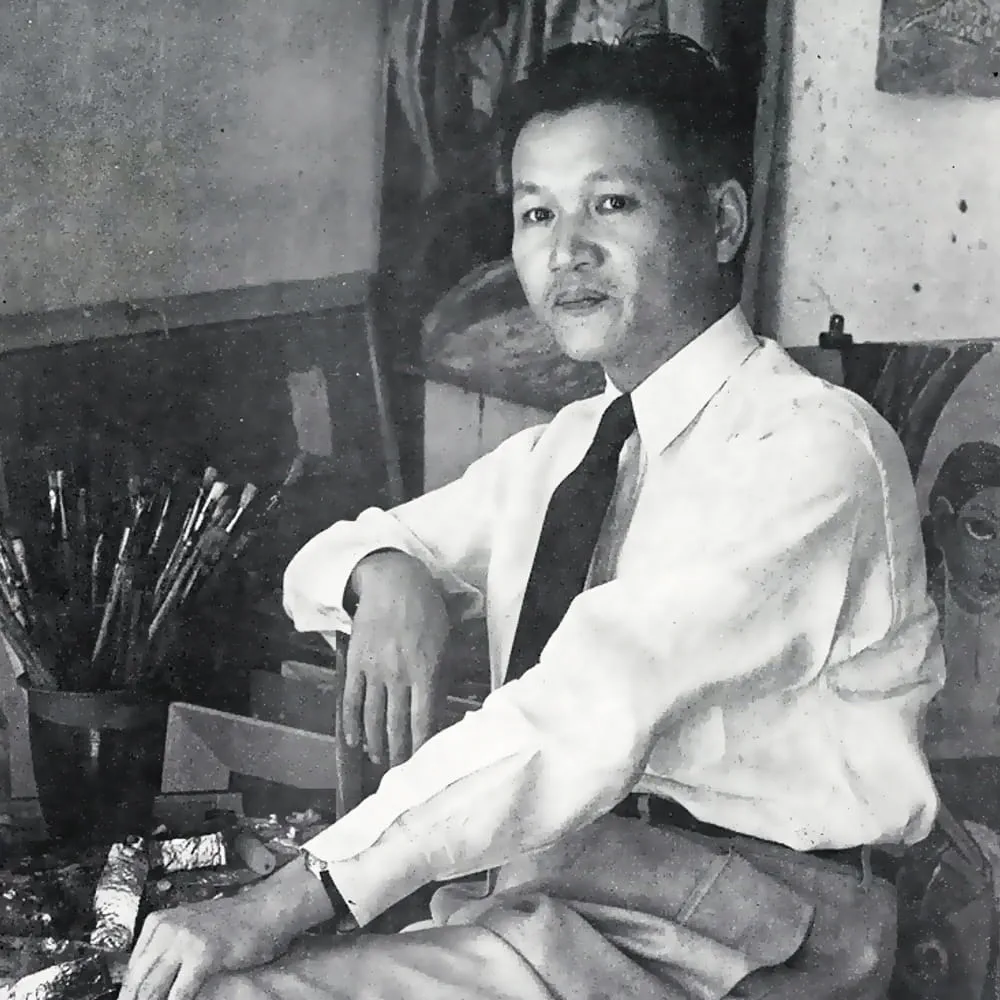 Cheong Soo Pieng in his studio, surrounded by paintbrushes and artworks, illustrating his pioneering role in 20th-century Southeast Asian modernism.