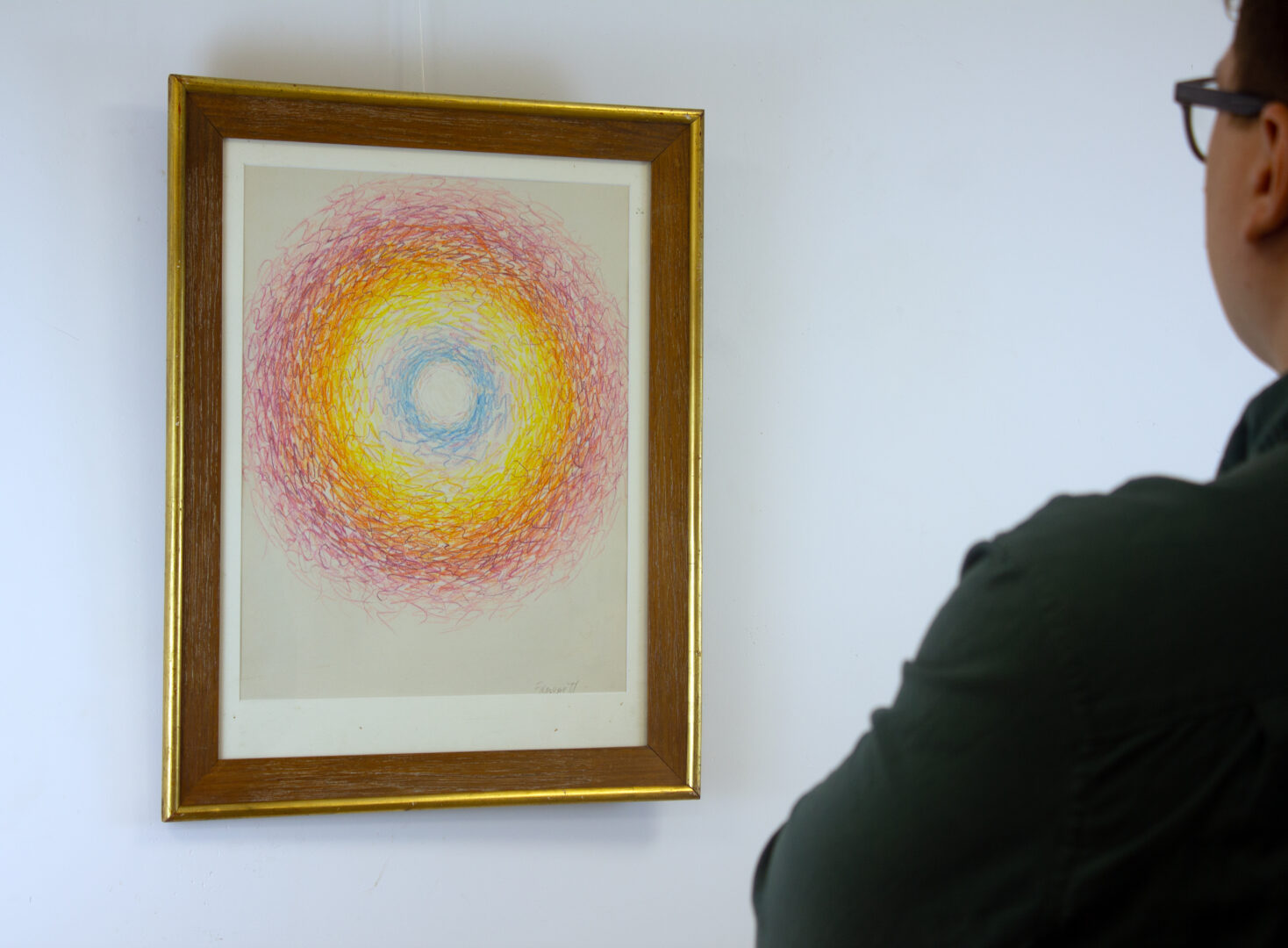 A person observing Circle, 1971, highlighting its size and framed presence.
