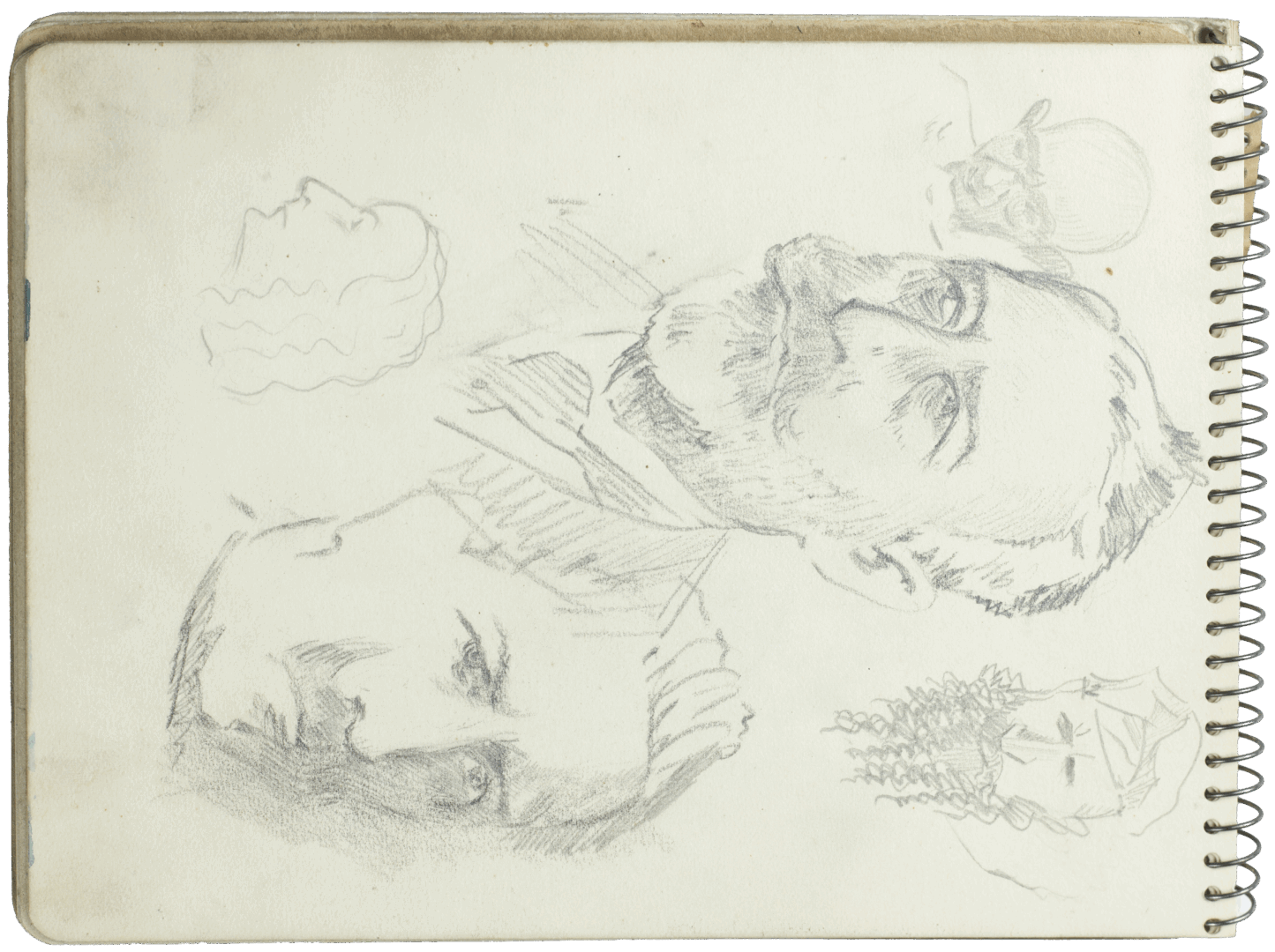 Portrait studies in pencil by Mariano Bertuchi, featuring multiple expressive male heads, including a bearded figure and a man in a turban.
