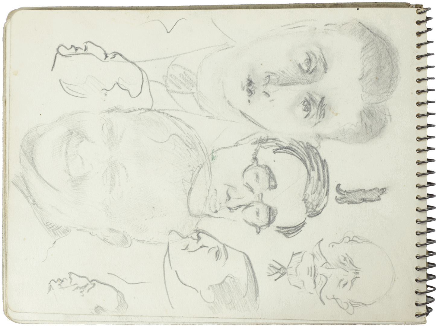 Sketchbook page with pencil portraits and caricatures by Mariano Bertuchi, showing varied facial expressions and drawing styles.