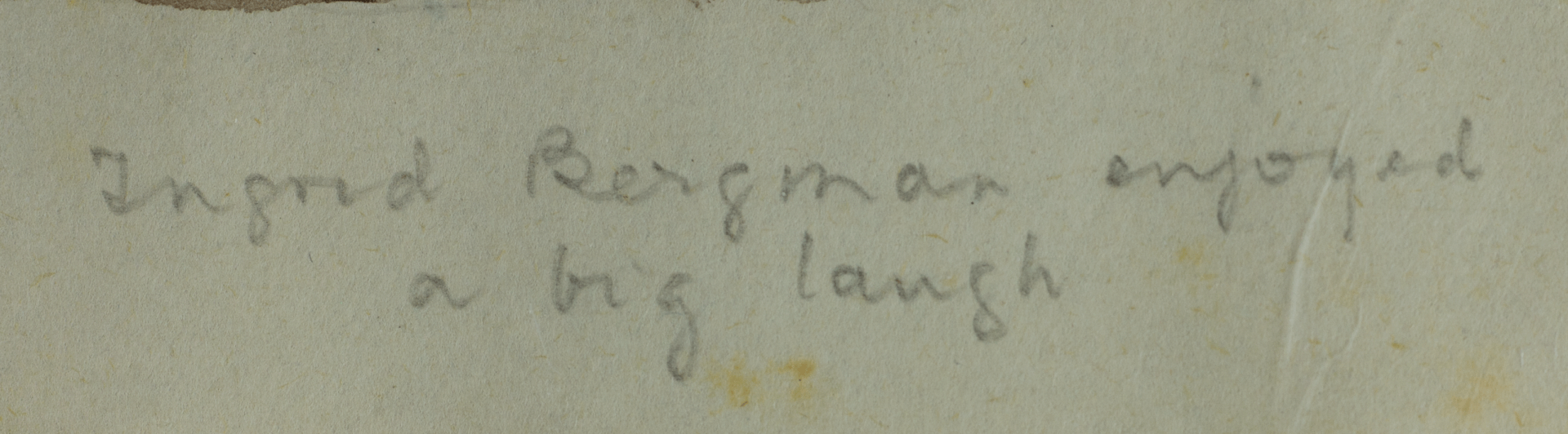 Detail of handwritten caption “Ingrid Bergman enjoyed a big laugh”