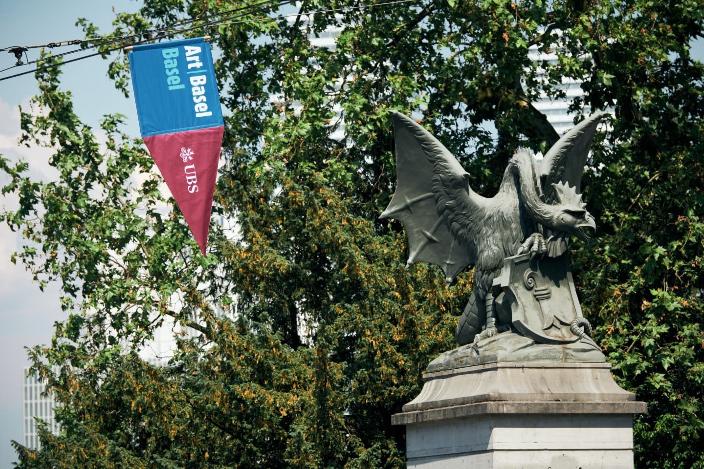 Art Basel 2025 banner displayed in Basel, highlighting the global art fair's presence and legacy | Aurora & Athena Auction House Art Basel 2025 banner displayed in Basel, highlighting the global art fair's presence and legacy