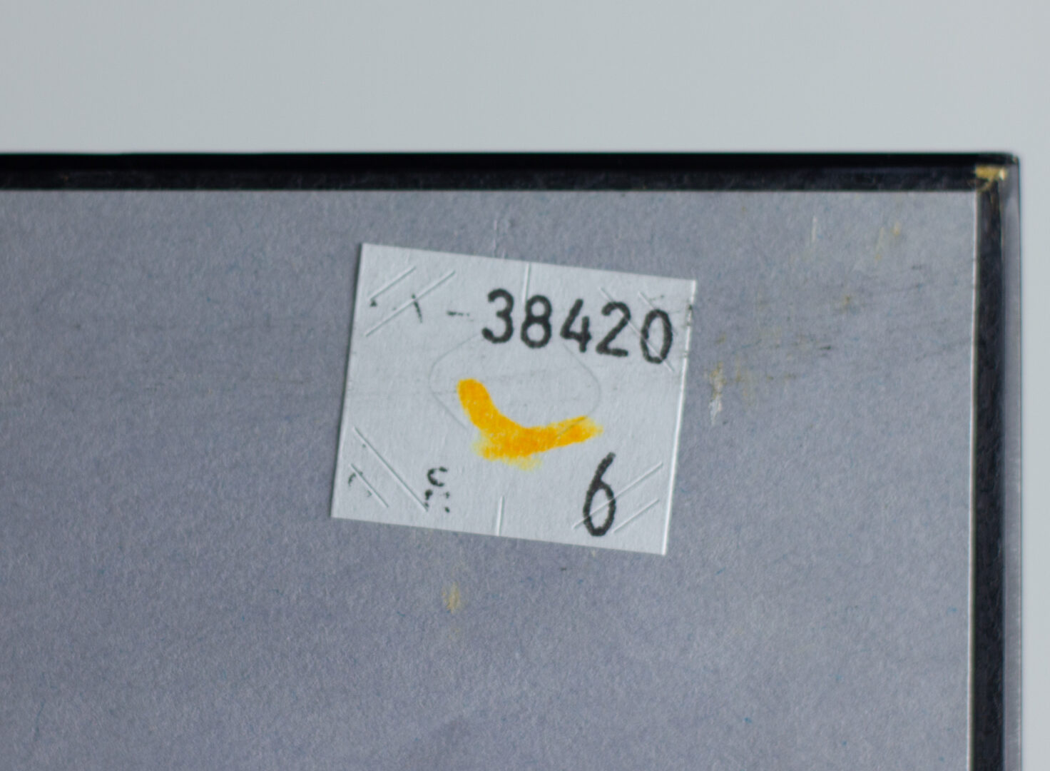 Reverse of the artwork Mother's Child I with provenance stickers and auction labels.
