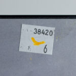 Reverse of the artwork Mother's Child I with provenance stickers and auction labels.