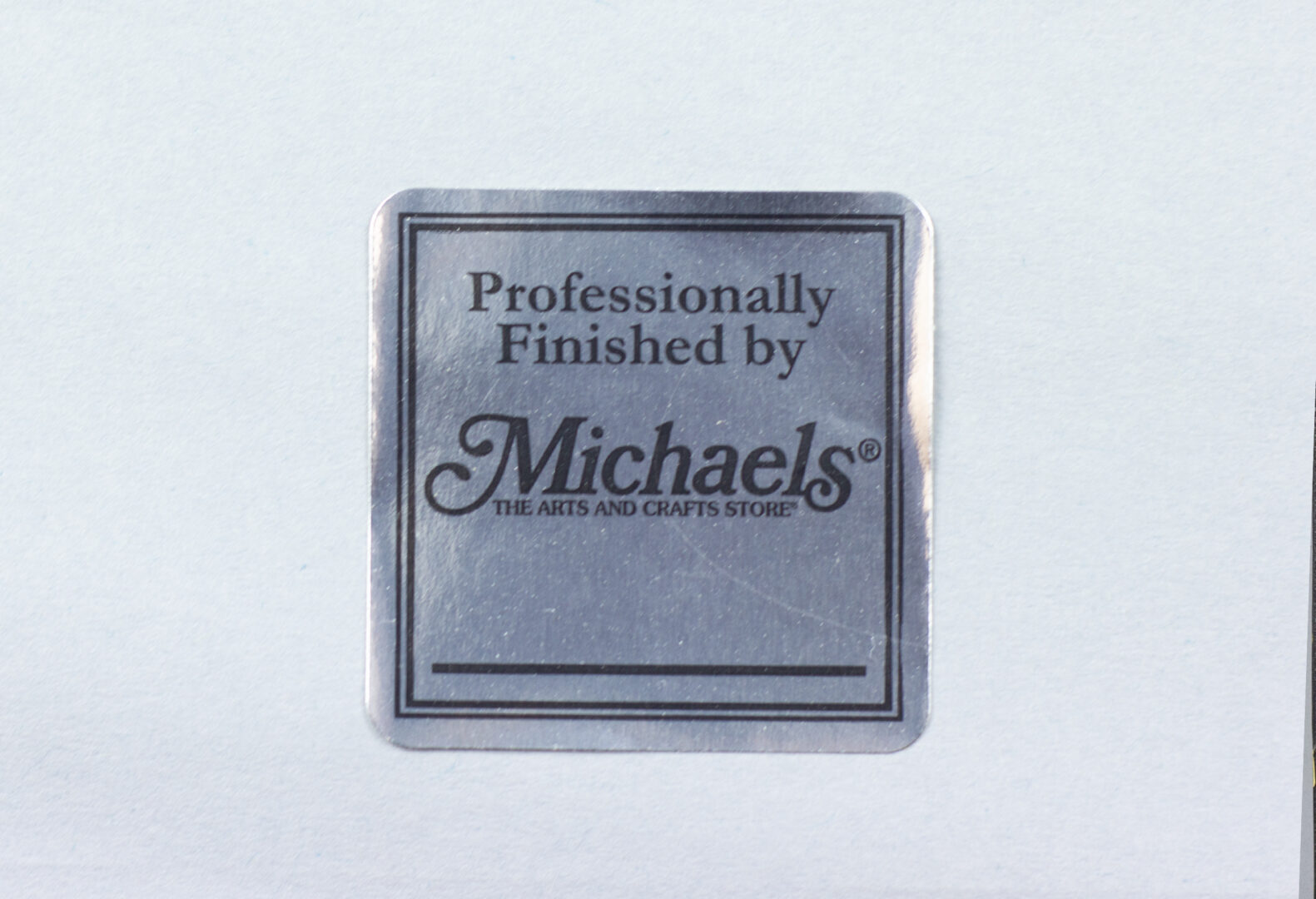 Reverse of the artwork Mother's Child I with provenance stickers and auction labels.