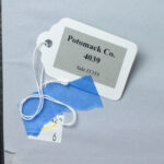 Reverse of the artwork Mother's Child I with provenance stickers and auction labels.