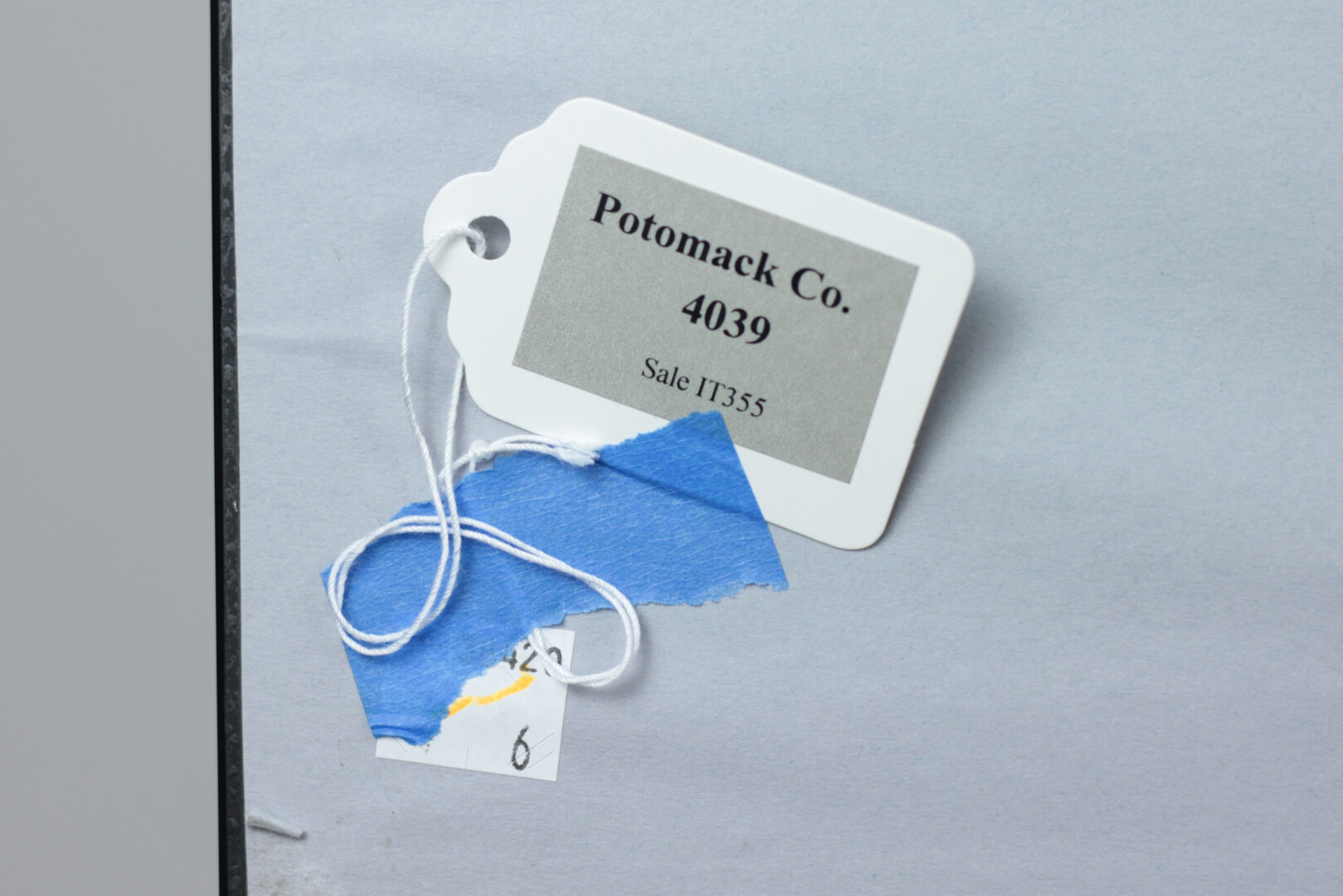 Reverse of the artwork Mother's Child I with provenance stickers and auction labels.