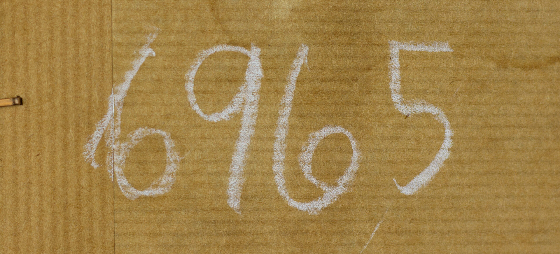 Inscribed verso number and circled price notation on the back of the artwork.