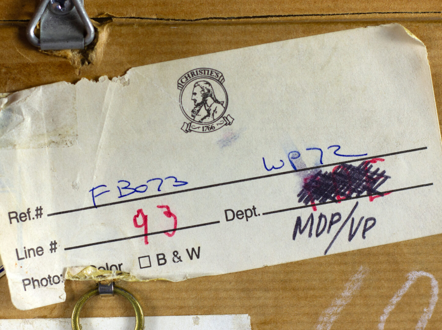 Archival label on the back of "Two Figures with Flags" with reference numbers.