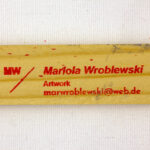 Red stamp with artist’s name, contact, and initials on the back stretcher of Jungle.