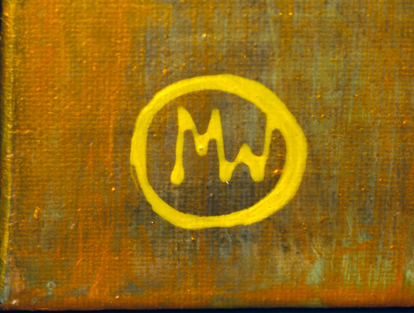 Monogram “MW” in yellow on the front of Jungle by Mariola Wroblewski.