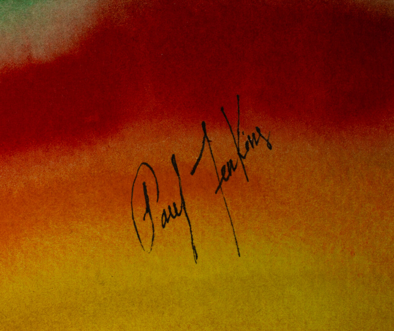 Close-up of Paul Jenkins' signature on his watercolor artwork "Flowing Spectrum", signed in black ink over red and orange wash.