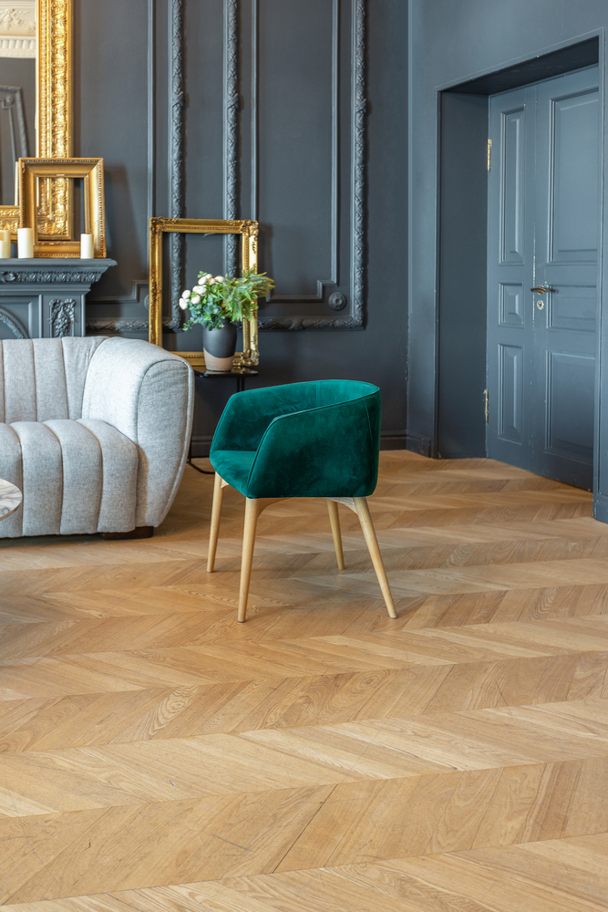Neo-Deco interior design trend 2026 featuring jewel tones and channel-tufted velvet furniture. | Aurora & Athena Auction House Neo-Deco interior design trend 2026 featuring jewel tones and channel-tufted velvet furniture.