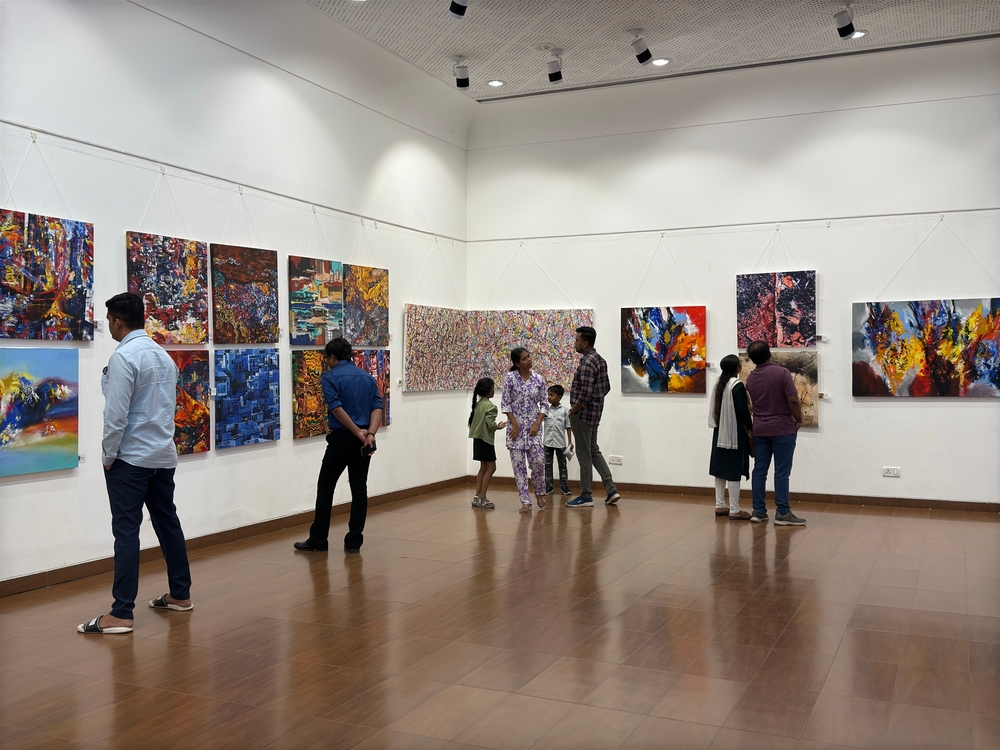 A vibrant contemporary art piece featuring traditional Indian motifs (paisley or lotus) reimagined in sharp, futuristic neon geometry. The artwork is hanging in a sleek, white-cube gallery space. In the foreground, a subtle holographic upward-trending graph symbolizes the 5% GST catalyst. | Aurora & Athena Auction House A vibrant contemporary art piece featuring traditional Indian motifs (paisley or lotus) reimagined in sharp, futuristic neon geometry. The artwork is hanging in a sleek, white-cube gallery space. In the foreground, a subtle holographic upward-trending graph symbolizes the 5% GST catalyst.