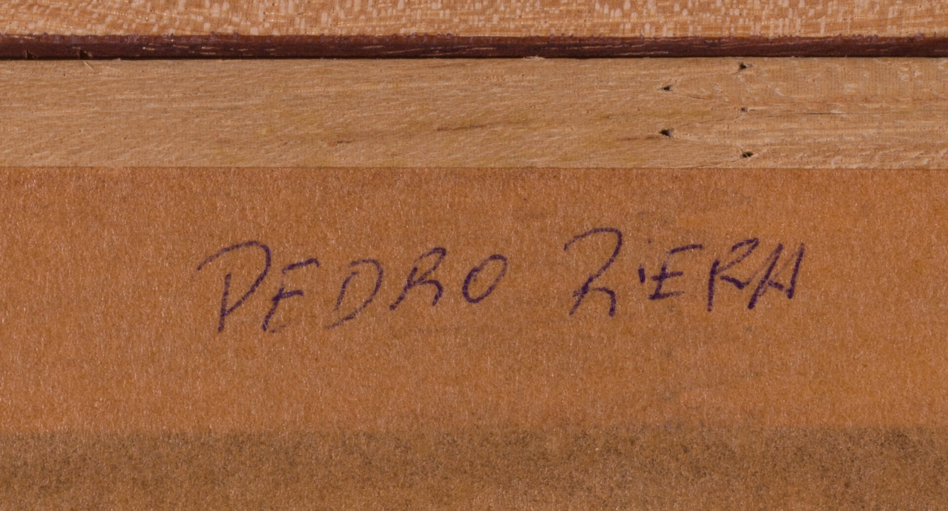 Handwritten artist attribution on the back of the Pere Riera painting