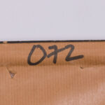 Detail of the framing label on the back
