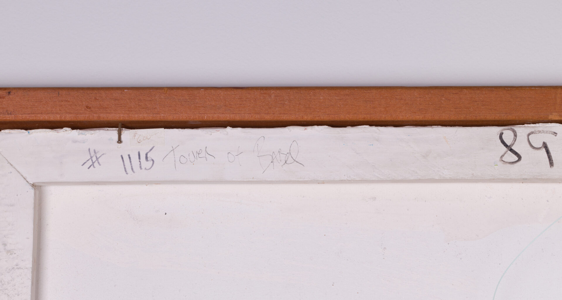 Inscription "# 1115 Tower of Babel" on the back