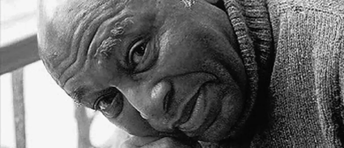Black and white portrait of South African artist Gerard Sekoto resting his head on his hand
